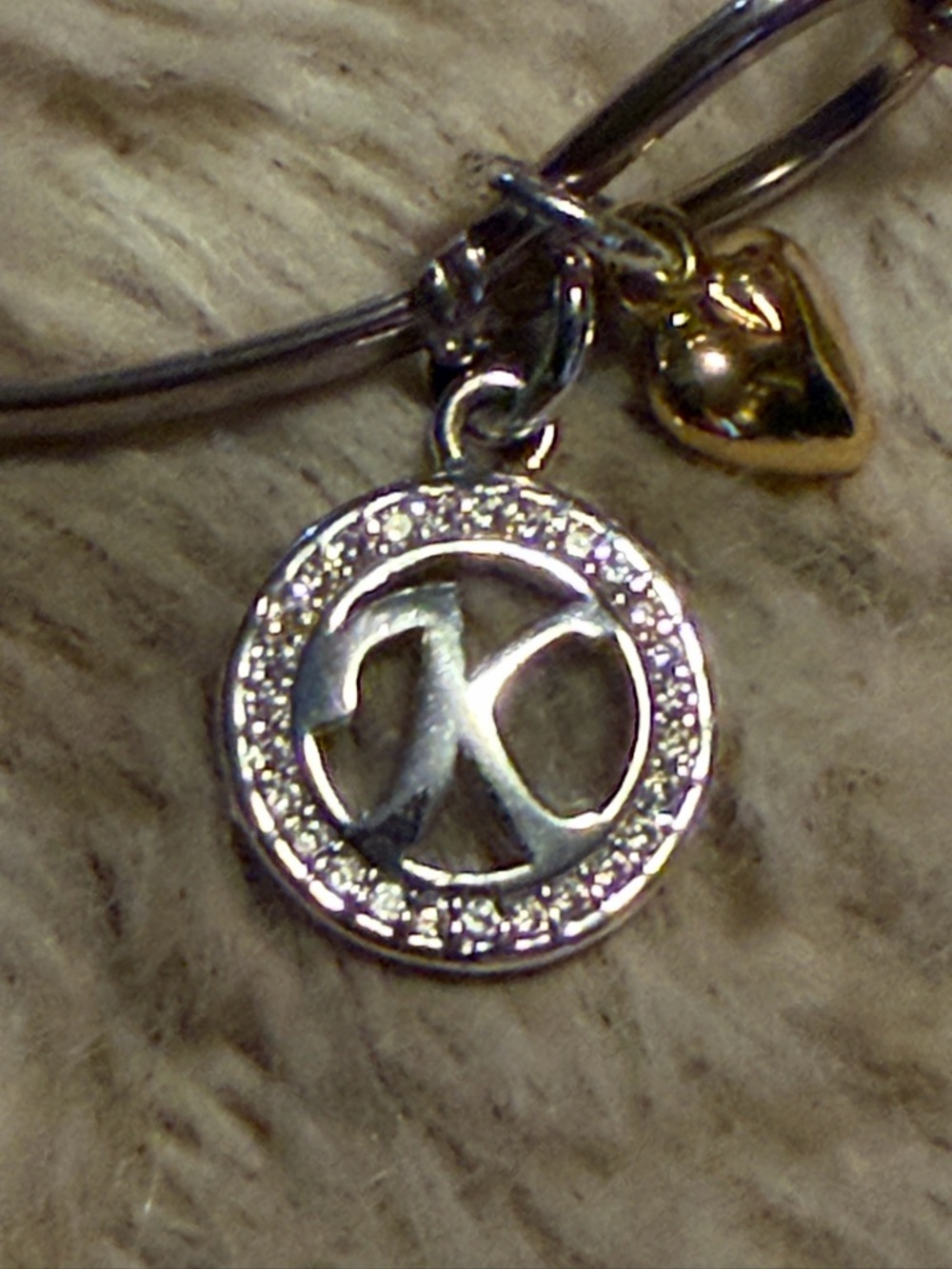 Silver Tone Charm Bangle Bracelet with Gold Heart Accent with the letter K - Picture 2 of 2